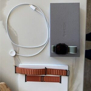 Apple Watch Ultra 3 with Green Trail Loop and Terra Cotta Alpine Loop Band